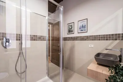 a bathroom with a shower and a sink at The Best Rent - Peaceful oasis with garden near the Colosseum in Rome