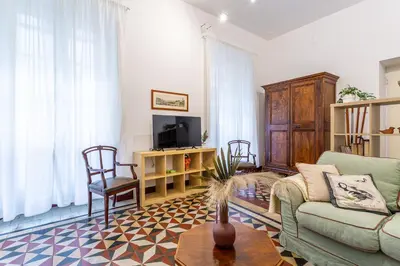 a living room with a couch and a tv at Iflat Comfortable & Spacious Dolce Vita Retreat in Rome