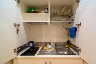 a kitchen with a sink and a counter top at Luxury Trevi in Rome