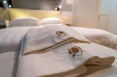 two towels with crabs on them sitting on a bed at Luxury Trevi in Rome