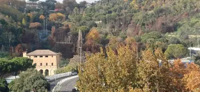 a building on the side of a mountain with a road at Casetta clodio in Rome
