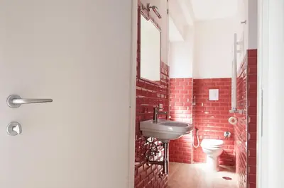 a bathroom with a sink and a toilet at Domus Casaletto in Rome