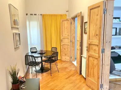a small dining room with a table and chairs at Two Bedrooms Spanish Steps Apartment in Rome
