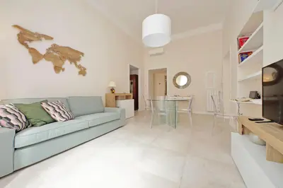 a living room with a couch and a table at Balconcino romantico a via Aosta in Rome