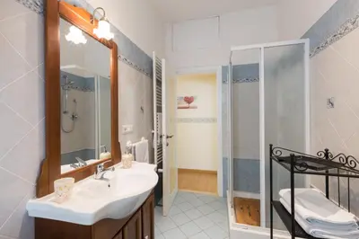 a bathroom with a sink and a shower at Casa Vacanze La Bomboniera in Rome