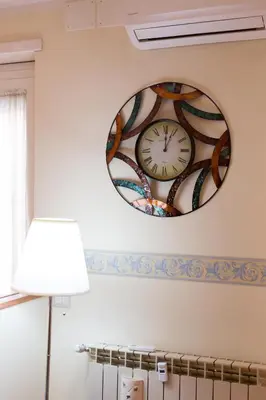 a clock on the wall in a room at Casa Vacanze La Bomboniera in Rome