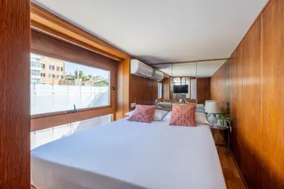 a large white bed in a room with a window at Suite Spagna - Terrazza su Piazza di Spagna in Rome