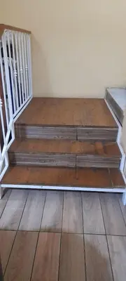 a set of wooden stairs in a room at Kotel rome residenza piazza bologna in Rome