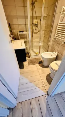 a bathroom with a toilet and a sink and a shower at Kotel rome residenza piazza bologna in Rome