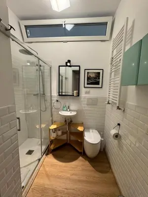 a bathroom with a shower and a sink and a toilet at La Spezia 28 Royal in Rome