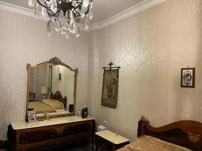 a bedroom with a mirror and a bed and a dresser at Domus Amra in Rome