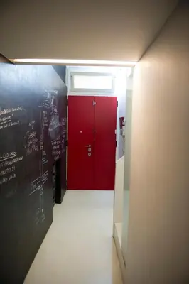 a hallway with a red door in a room at Modern Loft in the center of Rome in Rome