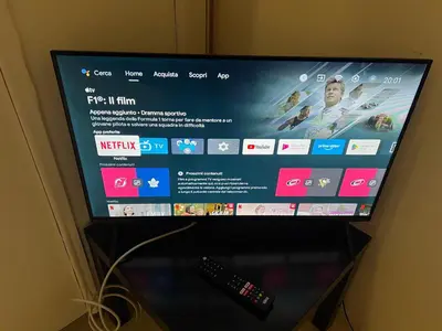 a flat screen television with a remote control at Modern Loft in the center of Rome in Rome