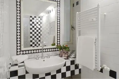 a bathroom with a sink and a mirror at A Star Inn in Rome