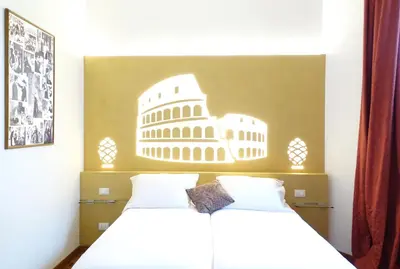 a bedroom with two beds and a wall with a picture at A Star Inn in Rome