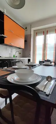 a kitchen with a table with plates and utensils on it at CasAppia in Rome
