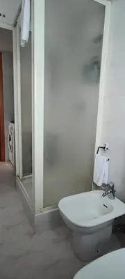 a bathroom with a toilet and a sink at CasAppia in Rome