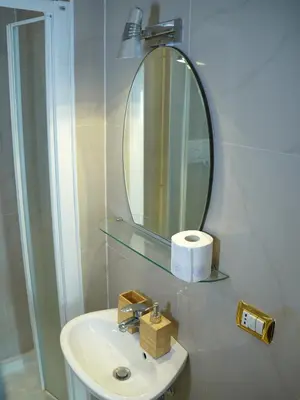 a bathroom with a sink and a mirror at Charming Home in Termini in Rome