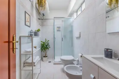 a bathroom with a toilet and a shower and a sink at Villa Gatta in Rome