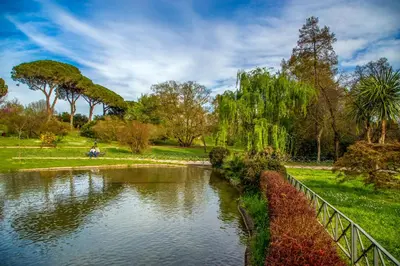 a person riding a boat in a pond in a park at Vatican Aurelia House - Vicino alla metro e al Vaticano - Luminoso e moderno in Rome