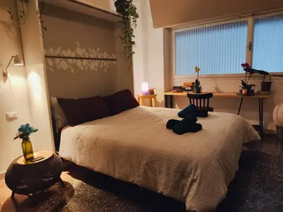 a bedroom with a bed with two pillows on it at That's Theatre House, near the Colosseum! in Rome