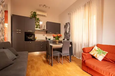 a kitchen with a flat screen tv and a microwave at Domus Trionfale 6780 in Rome