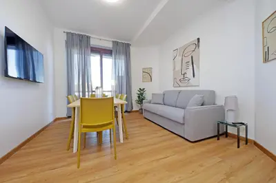 a living room with a couch and a table at 4BNB - Baldo degli Ubaldi Big Apartment in Rome