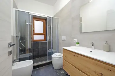 a bathroom with a toilet and a sink and a shower at 4BNB - Baldo degli Ubaldi Big Apartment in Rome