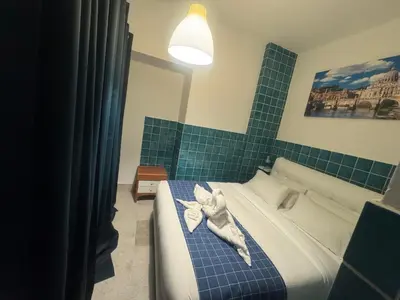 a bedroom with a bed with a stuffed animal on it at Munsi guest house in Rome