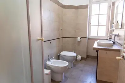 a bathroom with a toilet and a sink at Domus Magnagrecia in Rome