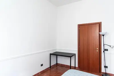 a room with a table and a door at Domus Magnagrecia in Rome