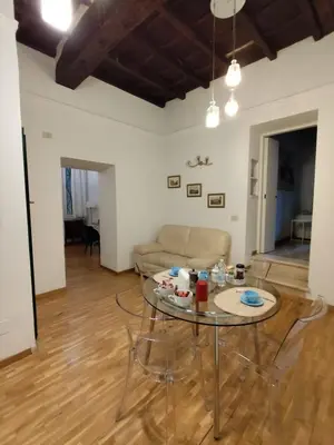 a living room with a table and a couch at Bijoux de Rome Navona Luxury Apartment in Rome