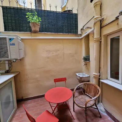 a table and chairs sitting on a patio at vacanze romane in Rome