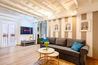 a living room with a couch and a table at Elegantis Monti Suite Apartment in Rome