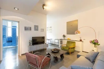 a living room with a couch and a tv at Secret Terrace by Rental in Rome in Rome