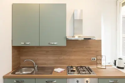 a kitchen with a sink and a counter top at Secret Terrace by Rental in Rome in Rome