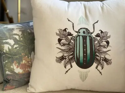 a beetle sitting on a pillow on a couch at CardinalBaldo in Rome
