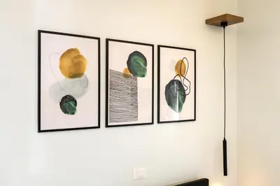 four framed pictures of leaves on a wall at Suite Room Suriani in Rome
