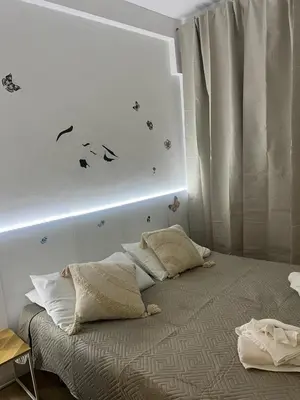 a bedroom with a bed with two pillows on it at Casa Roma in Rome