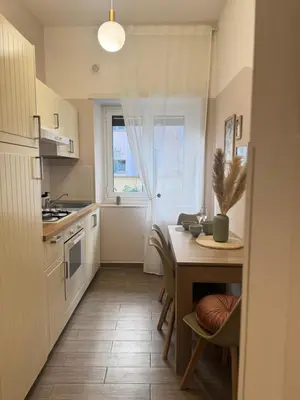 a kitchen with a table and a dining room at Vatican Exclusive Suite in Rome