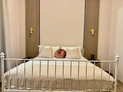 a bedroom with a bed with two pillows at Vatican Exclusive Suite in Rome