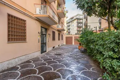 a cobblestone street in a city with buildings at Silver Dream Cornelia, Elegant Apt with Car Park in Rome
