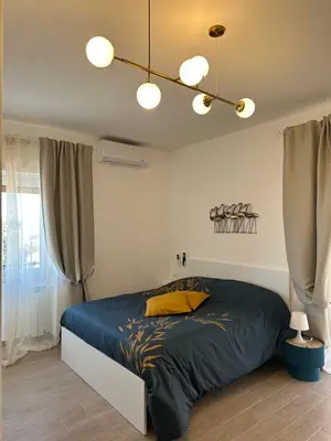 a bedroom with a large bed in a room at Monti Tiburtini Roma Guest House in Rome