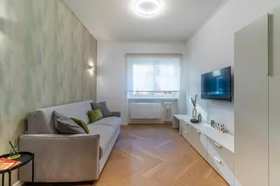 a living room with a couch and a tv at Cyprus - Roma's Delightful Lodges in Rome
