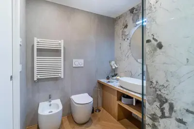 a bathroom with a toilet and a sink and a shower at Cyprus - Roma's Delightful Lodges in Rome