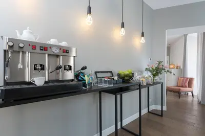 a kitchen with a counter with a coffee maker on it at Corso Vittorio 308 in Rome