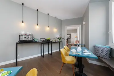 a kitchen and dining room with a table and chairs at Corso Vittorio 308 in Rome