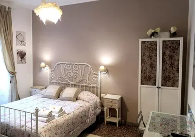a small bedroom with a bed and a dresser at La Chiave di Roma in Rome