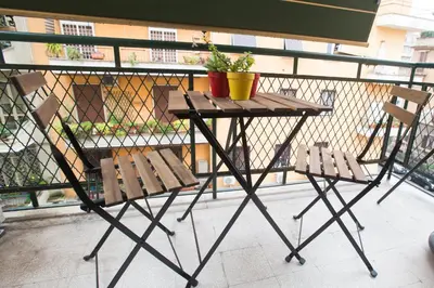 a table and two chairs on a balcony at La Chiave di Roma in Rome