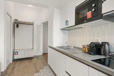 a kitchen with a sink and a counter top at Urban Loft - San Giovanni by RHR in Rome